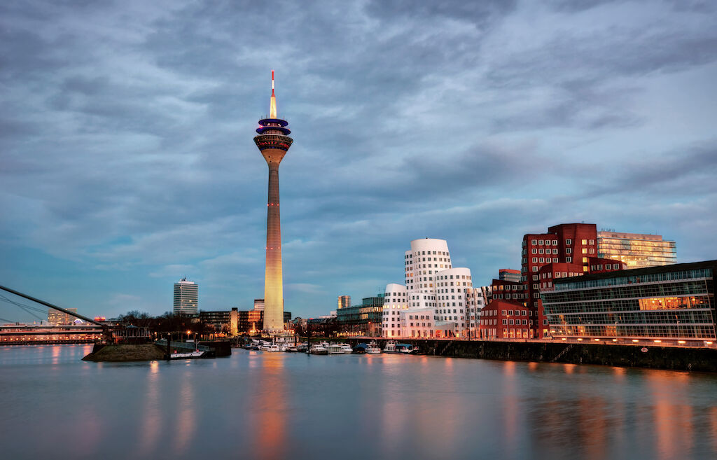 Premium Photo | View of dusseldorf at sunset with rhine tower (rheinturm)  and bridge over the rhine. ideal for websites and magazines layouts